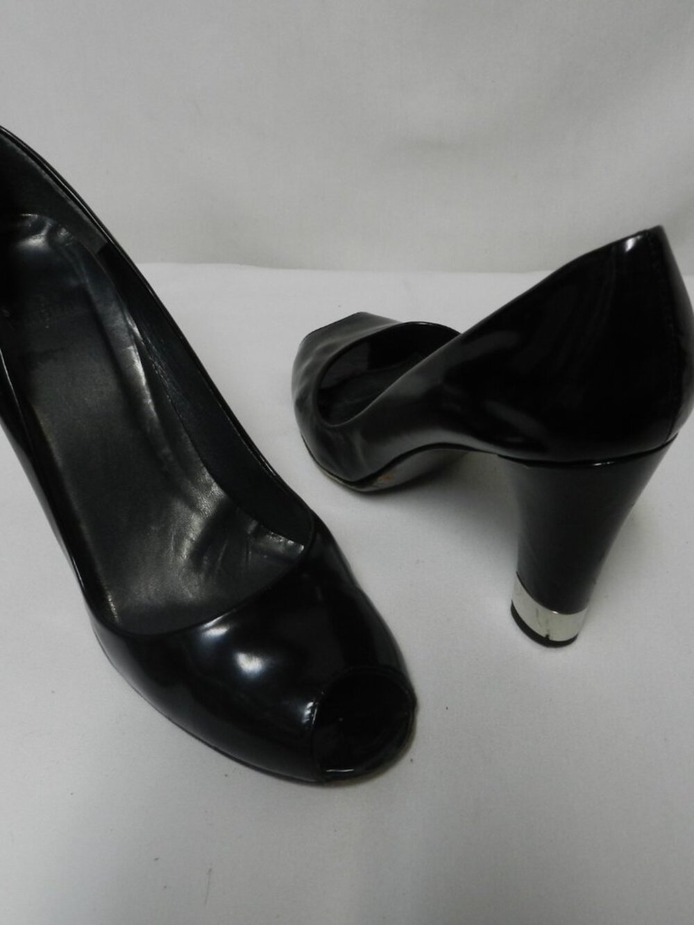 Stuart Weitzman Size 7.5 glossy Leather Peep toe w/silver trim heels pumps black